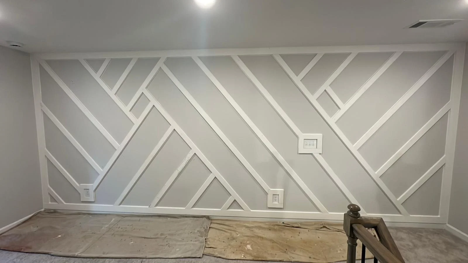 Custom geometric trim accent wall built by the G&G carpentry crew
